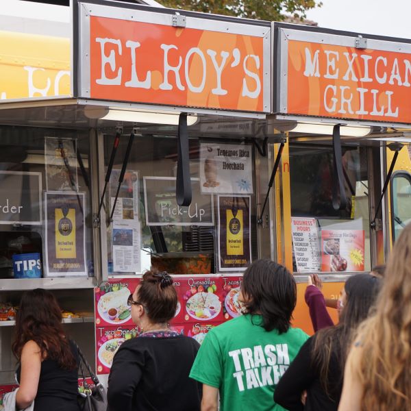 People standing in line at Elroy’s Mexican Grill food truck.